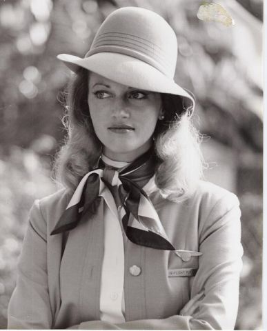 1970s Flight Attendant Judy Skartvedt poses in a uniform designed by Edith Head.